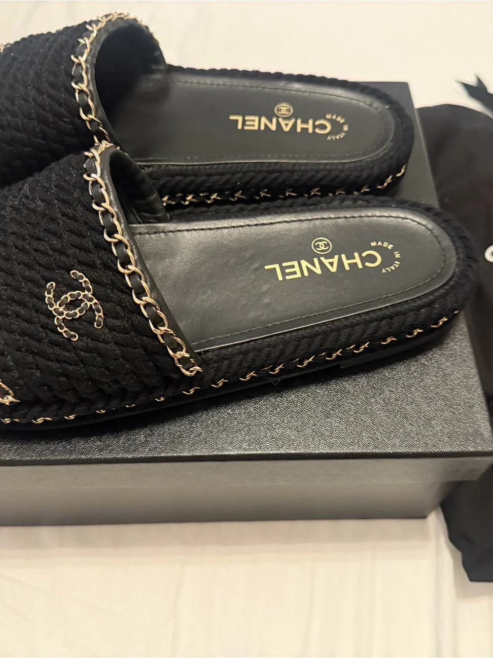 CHANEL Black Braided Slides with Gold Chain Accents